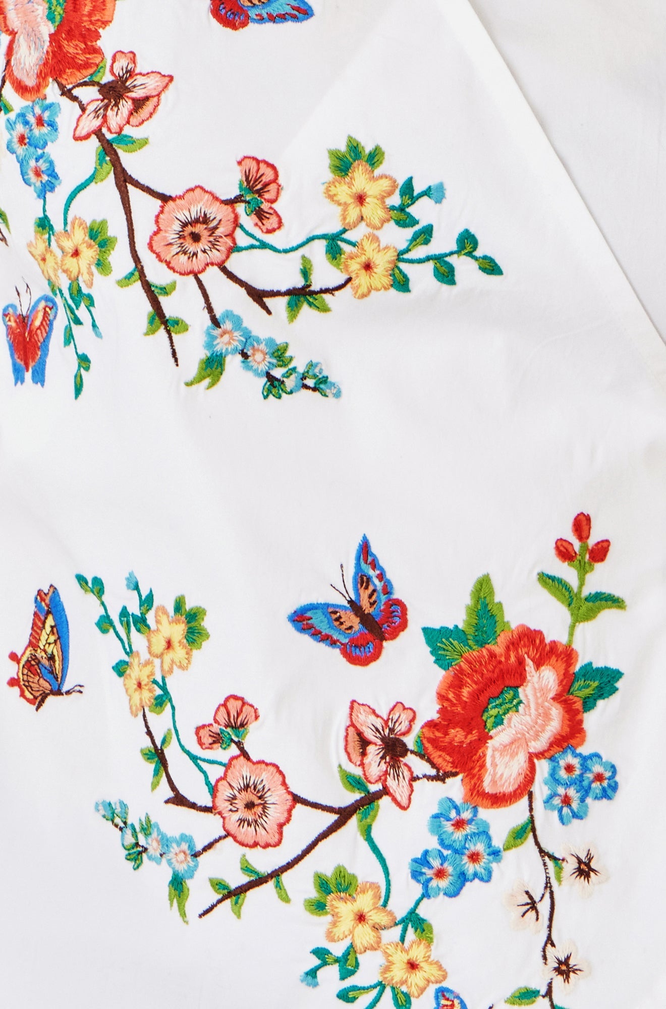 Yumi White Stretch Cotton Embroidered Wrap Top