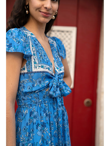Mela Blue Ditsy Print Sun Dress With Cross Over Back Tie Front And Dip Hem